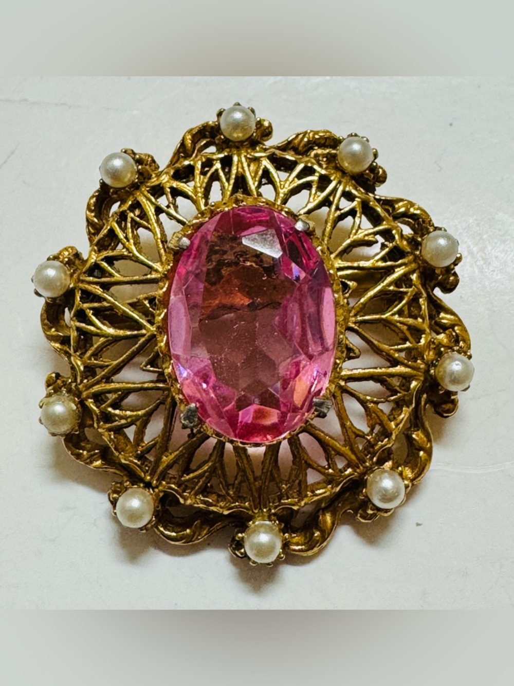 Florenza Gold Tone Filigree Brooch with Pink Rhinestone and Faux Pearl Accents